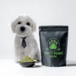 A white Maltese dog in a tie standing next to a large black bag of Dirty Paws Kratom–Green Jong Kong with a bright green paw print logo.