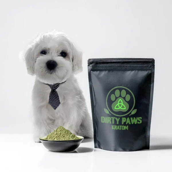 A white Maltese dog in a tie standing next to a large black bag of Dirty Paws Kratom–Green Jong Kong with a bright green paw print logo.